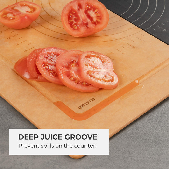 Close-up of Elihome wood fiber cutting board with sliced tomatoes, highlighting the deep juice groove that collects liquids. Text reads: "Deep Juice Groove. Prevent spills on the counter.