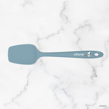 Blue spatula with a brand logo on a marble background