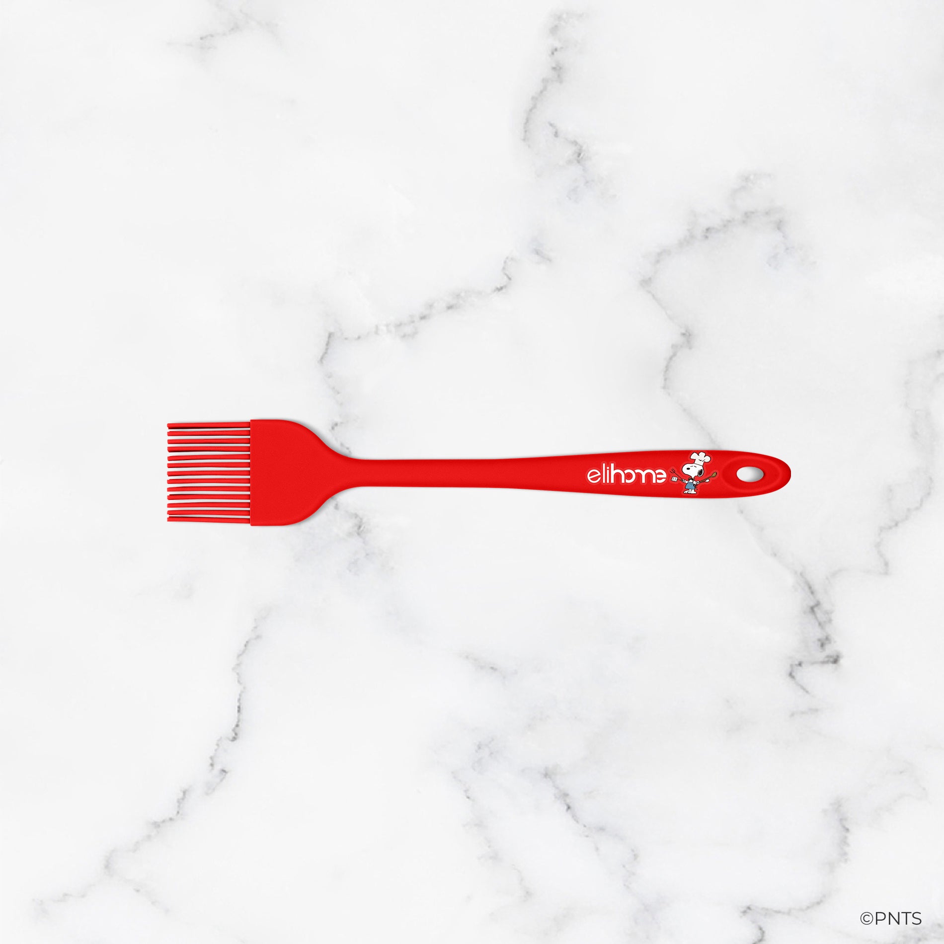 Red comb with 'ellipso' branding on a marble background