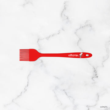 Red comb with 'ellipso' branding on a marble background
