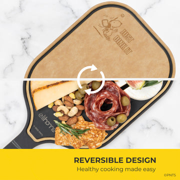 Reversible cutting board with food items on a marble background, featuring the brand 'Just Chopping'.