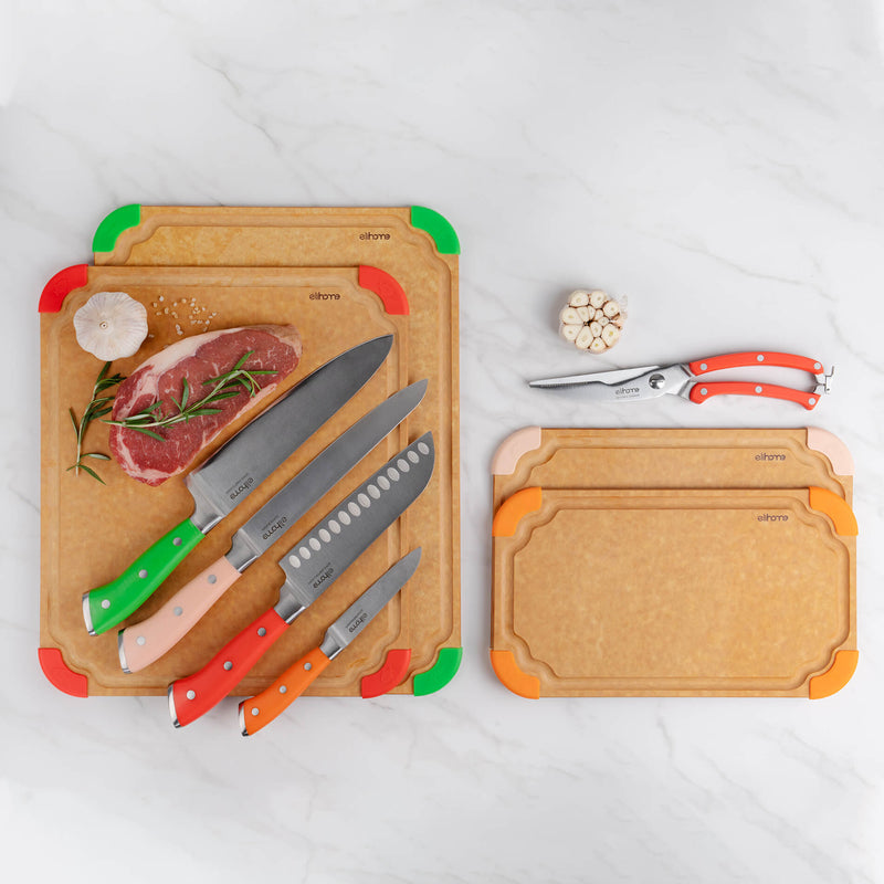 Elihome kitchen collection featuring wood fiber cutting boards in multiple sizes, colorful knife set, and poultry shears on marble background