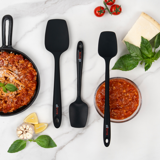 Elihome Classic, Skinny and Mini silicone spoonulas in Black on a marble counter beside a skillet of bolognese, a bowl of tomato sauce, parmesan and basil