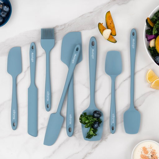 All eight Elihome silicone kitchen tools from the 8 Piece Set laid out together on a marble counter