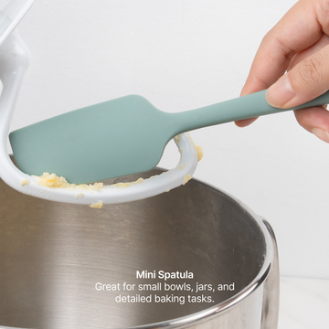 Elihome Mini Silicone Spatula from the silicone kitchen tool set in use, scraping batter from a stand mixer bowl