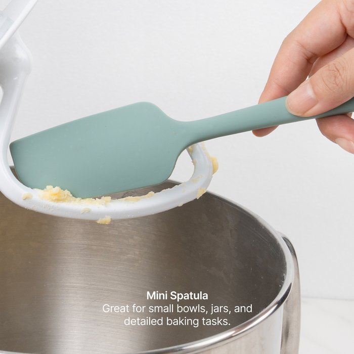 Elihome Mini Silicone Spatula from the silicone kitchen tool set in use, scraping batter from a stand mixer bowl