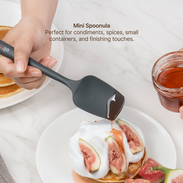 Elihome Mini Silicone Spoonula from the silicone kitchen tool set in use, spooning honey over figs and cream
