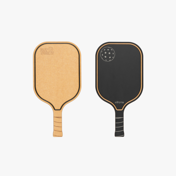 Elihome pickleball paddle cutting board shown from both sides, natural wood fiber engraved with Just Dink It and a reversible black serving side