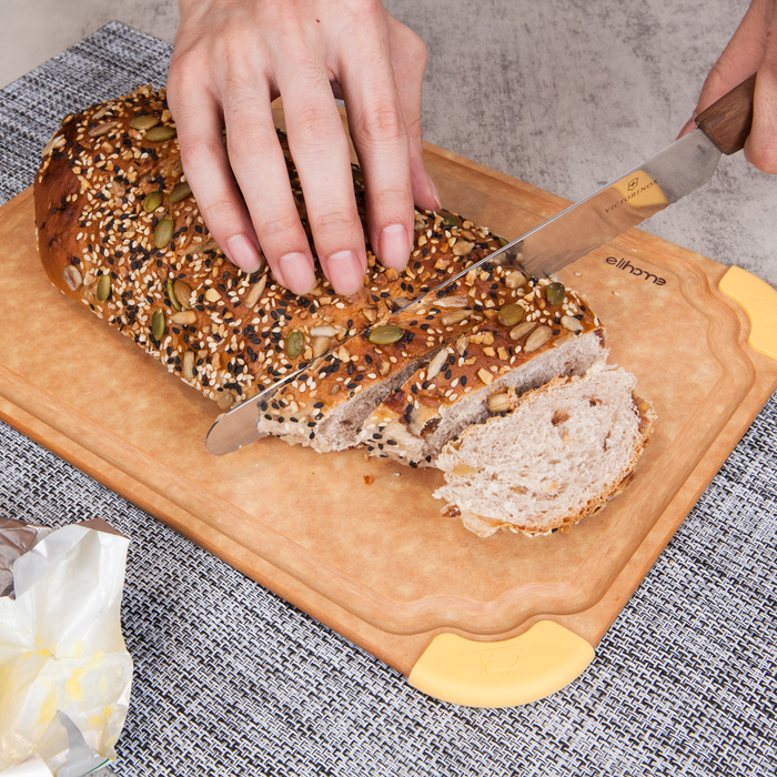 Slicing bread on Elihome Premium Series Medium Cutting Board